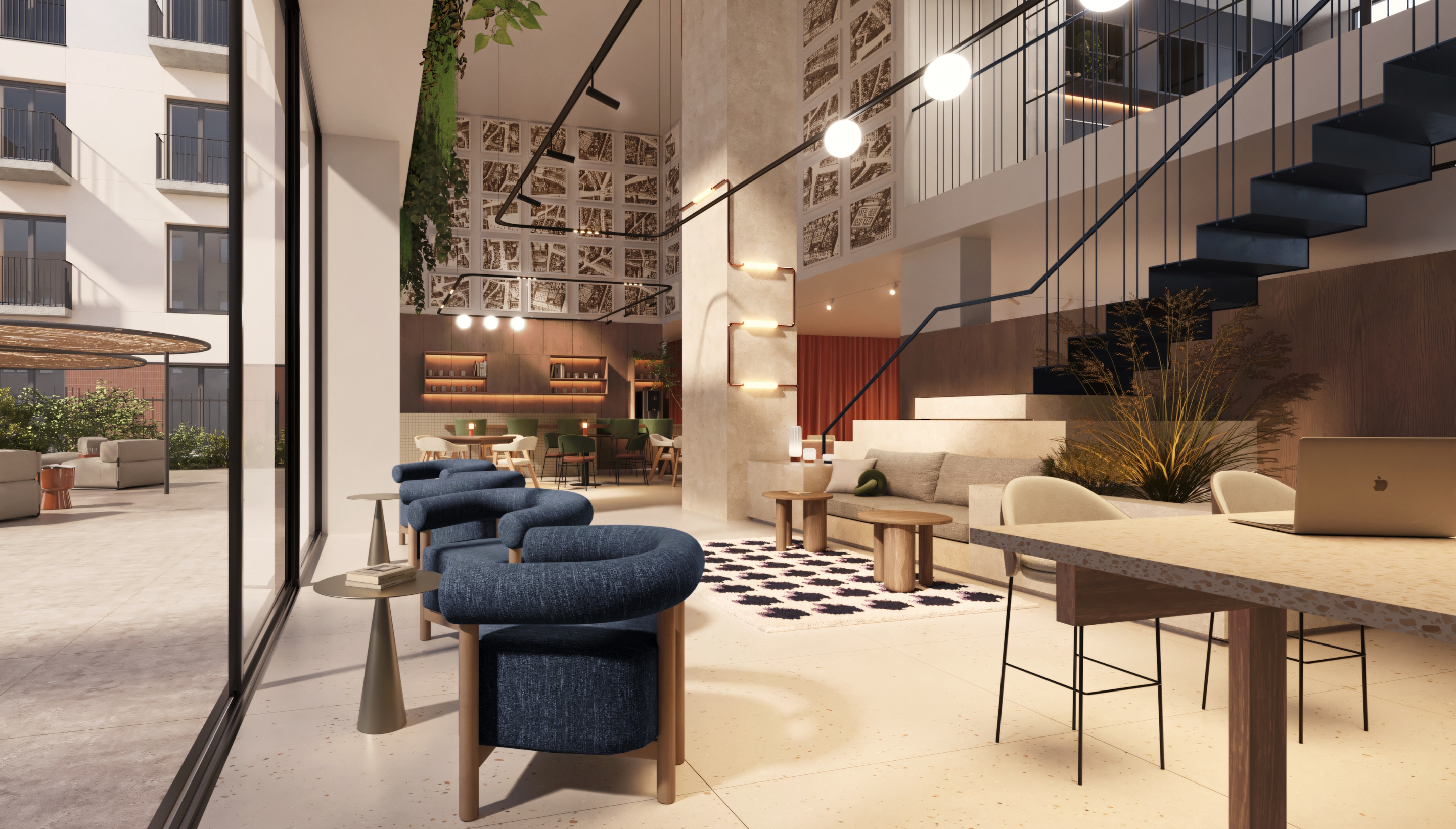 Espacio de coworking en Calido Living, con muebles modernos, iluminación cálida y áreas de trabajo compartidas.